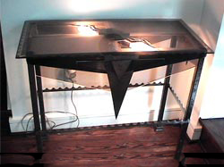 This is a large custom table (named Table 1) with Functional Lights that accent this steel table with etched glass top. This is a forward view of this custom piece of furniture.  Art function studio manufactures creative lighting displays & specialty lighting for your home or business. These lighting displays are custom made and manufactured to your specifications. Greg Rosenwald is the owner and operator of Art Function studio. Greg will travel at least 200 miles to meet with you. Art Function Studio is located in Rydal Pa 19046. Some areas covered by Art Function Studio are Pennsylvania, New York, New Jersey, Delaware, Maryland and Virginia. Local areas include: Philadelphia PA, Rydal Jenkintown Meadowbrook in 19046, Bryn Athyn Bethayres Huntingdon Valley 19006, 10953 Feasterville-Trevose, 19001 Abington-Roslyn, 18966 Southampton, 19020 Bensalem, 19040 Hatboro, 19090 Willow Grove Horsham, and on the main line Bryn Mawr, Wynnewood, Villanova, Wayne. 